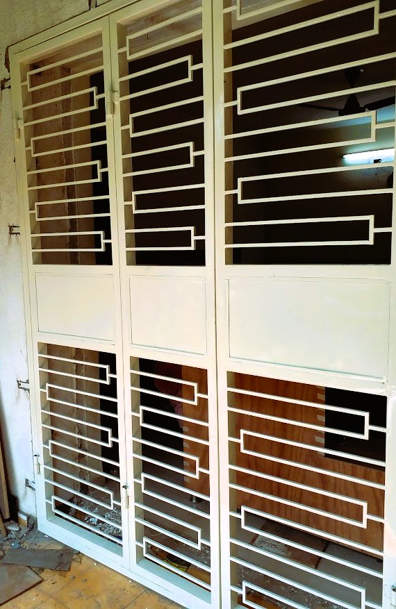 Designer balcony grill door with a unique pattern for a modern apartment.